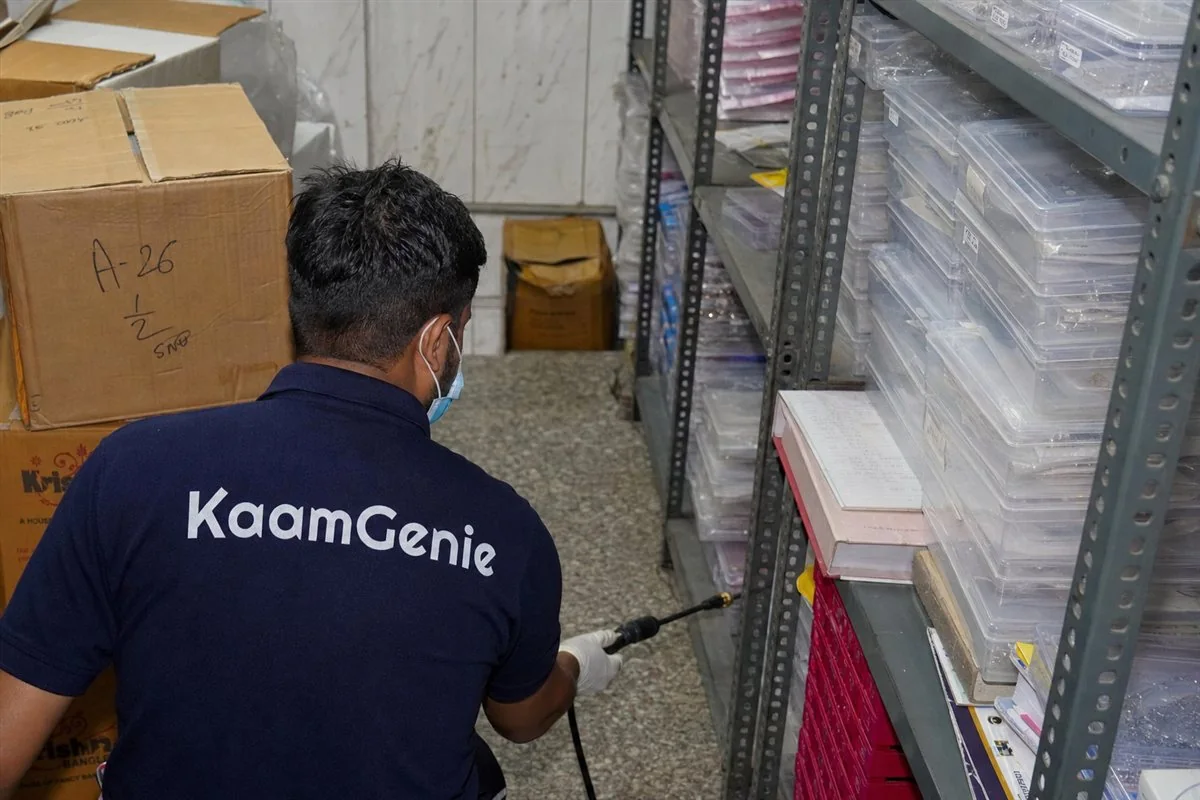 KaamGenie pest control technician treating a Naya Bans property in North Delhi / Central Delhi