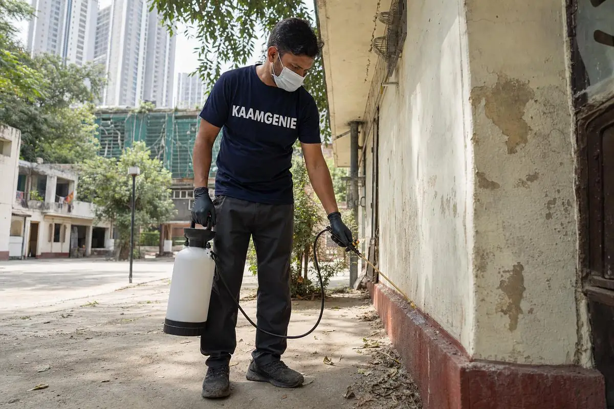 KaamGenie pest control technician treating a Netaji Nagar property in North & Central Delhi