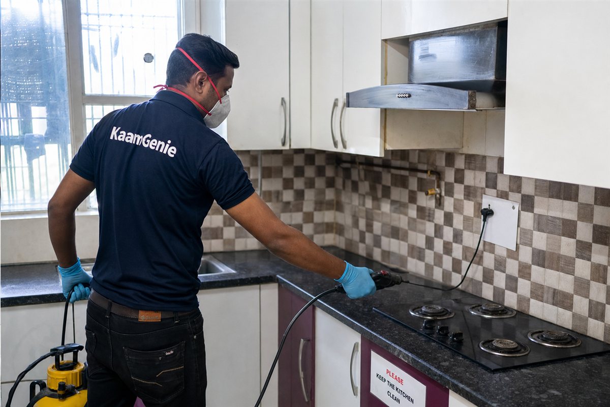 KaamGenie pest control technician treating a Nimri Colony property in North Delhi / Central Delhi
