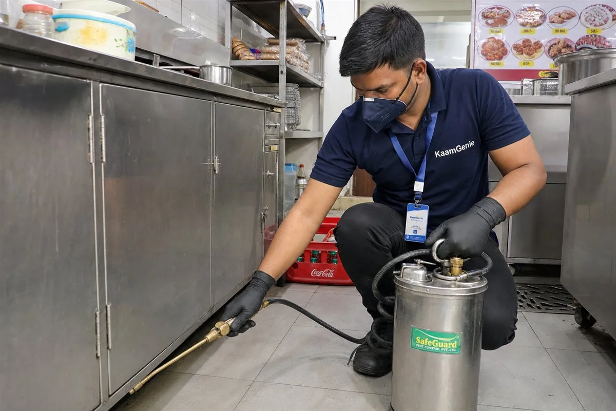 KaamGenie pest control technician treating a Nirman Vihar property in East Delhi