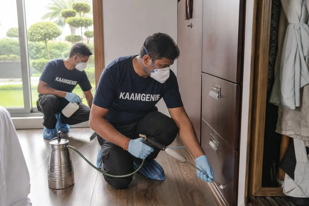 KaamGenie pest control technician treating a Nirvana Country property in Gurgaon