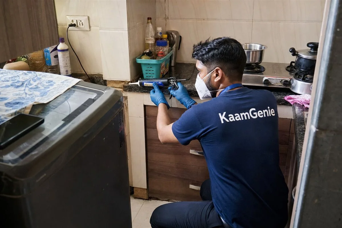 KaamGenie pest control technician treating a Palam property in South-West Delhi