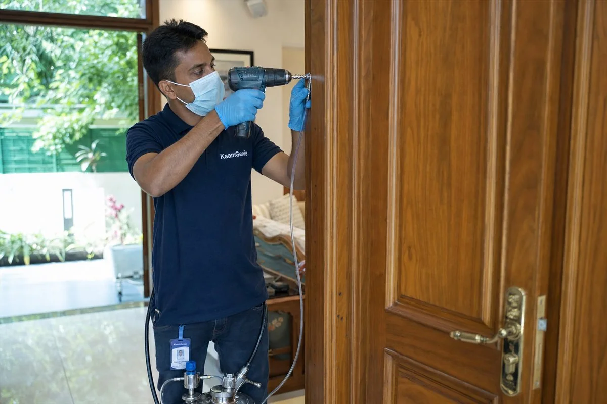 KaamGenie pest control technician treating a Punjabi Bagh property in West Delhi