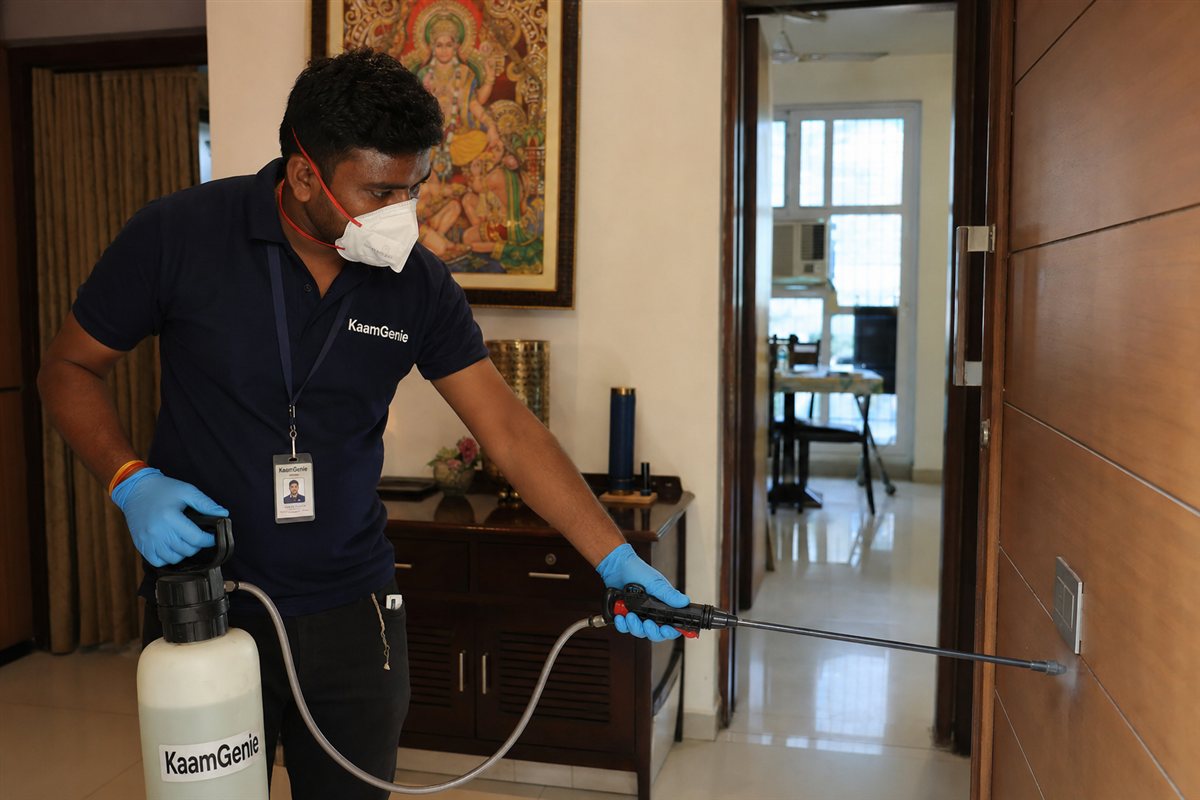 KaamGenie pest control technician treating a planned DDA society in Pushp Vihar on MB Road, South Delhi