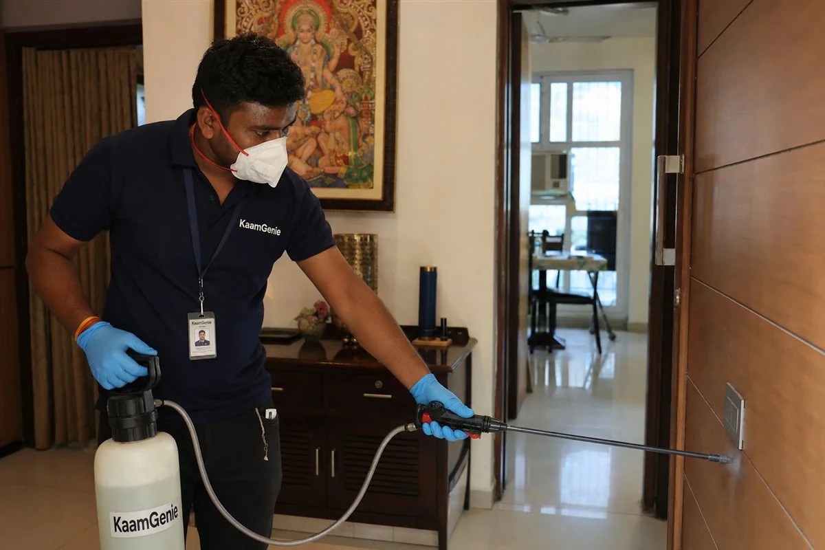 KaamGenie pest control technician treating a planned DDA society in Pushp Vihar on MB Road, South Delhi