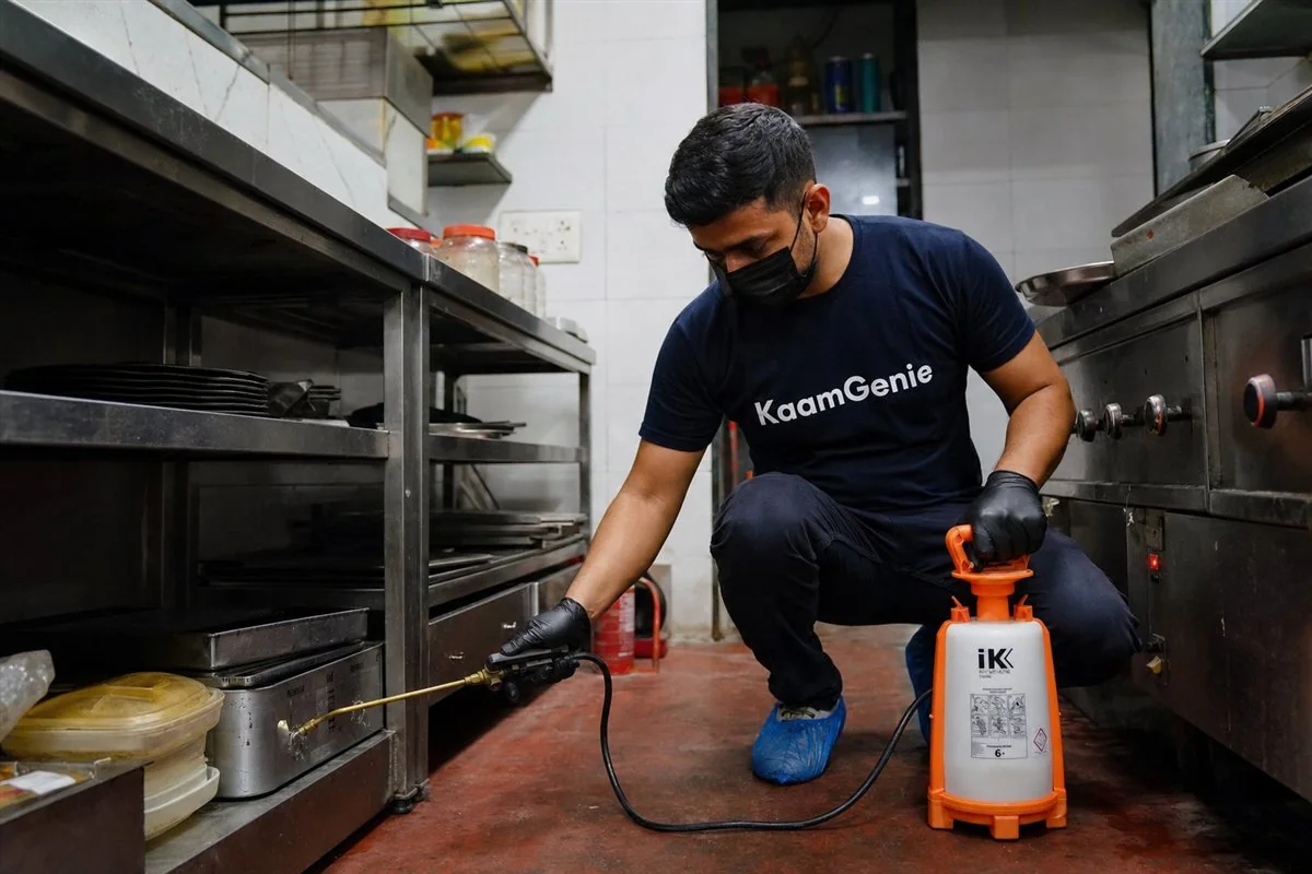 KaamGenie pest control technician treating a Ramprastha property in East Delhi