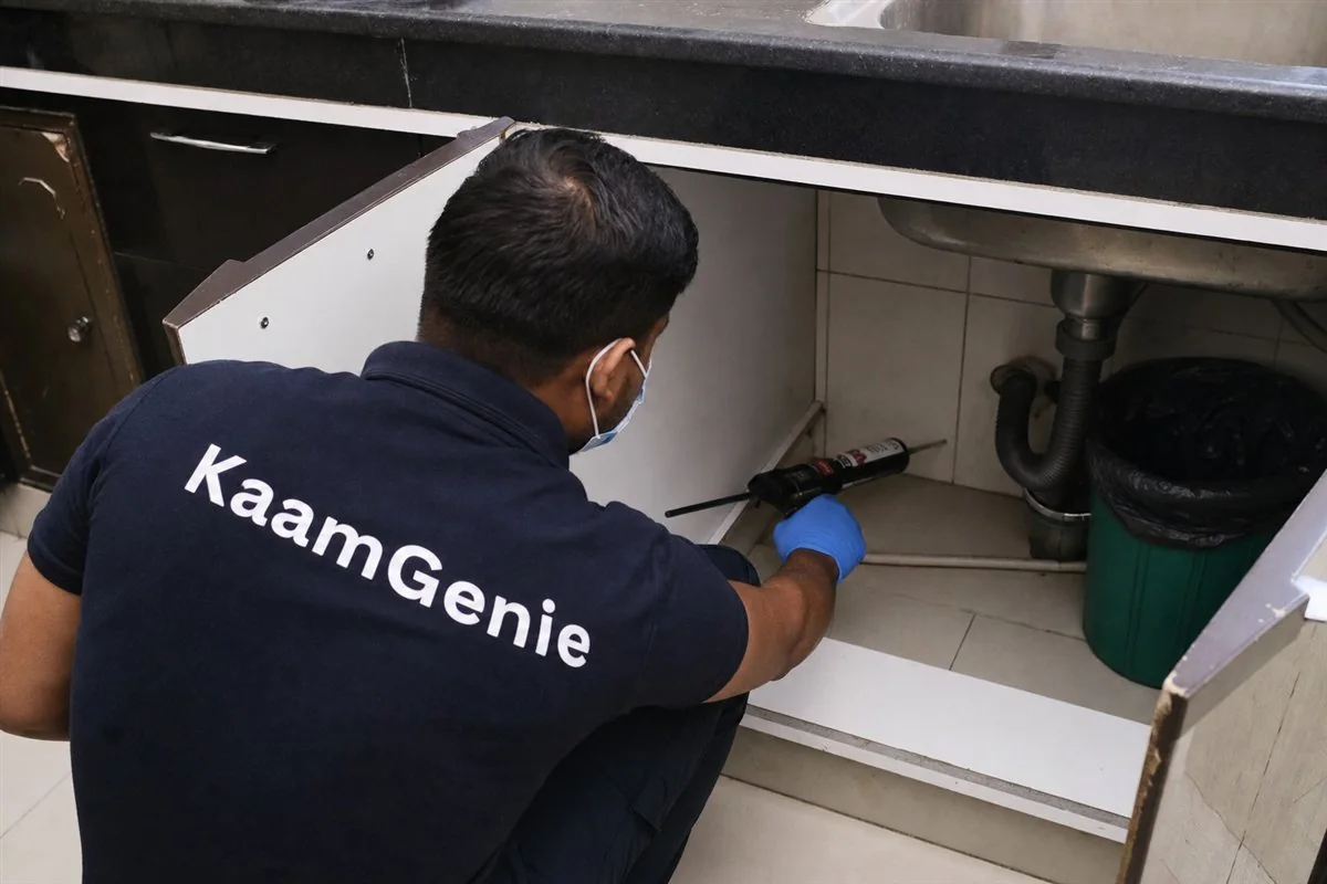 KaamGenie pest control technician treating a Rohini Sector 1 property in North-West Delhi