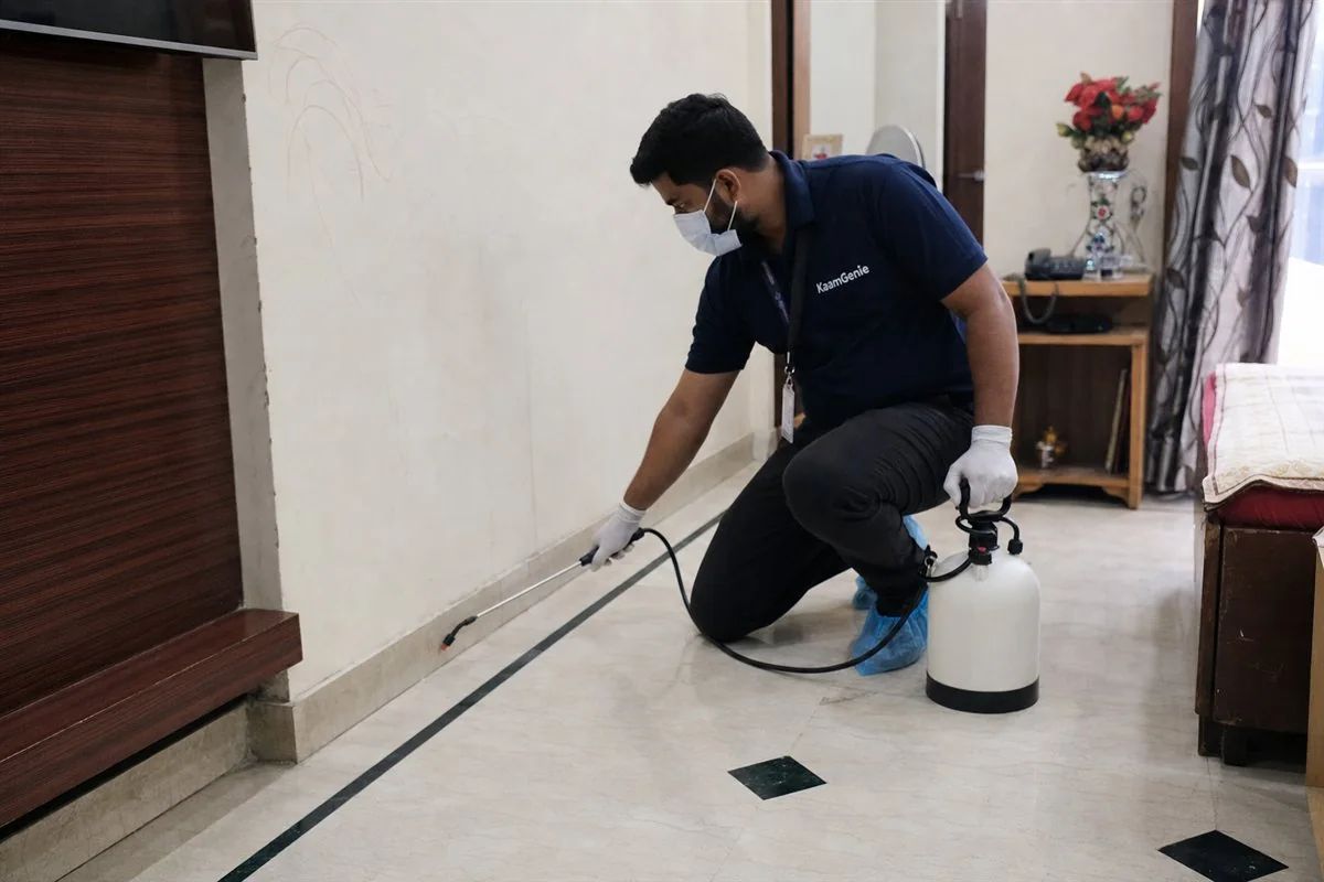 KaamGenie pest control technician treating a Rohini Sector 12 property in North-West Delhi