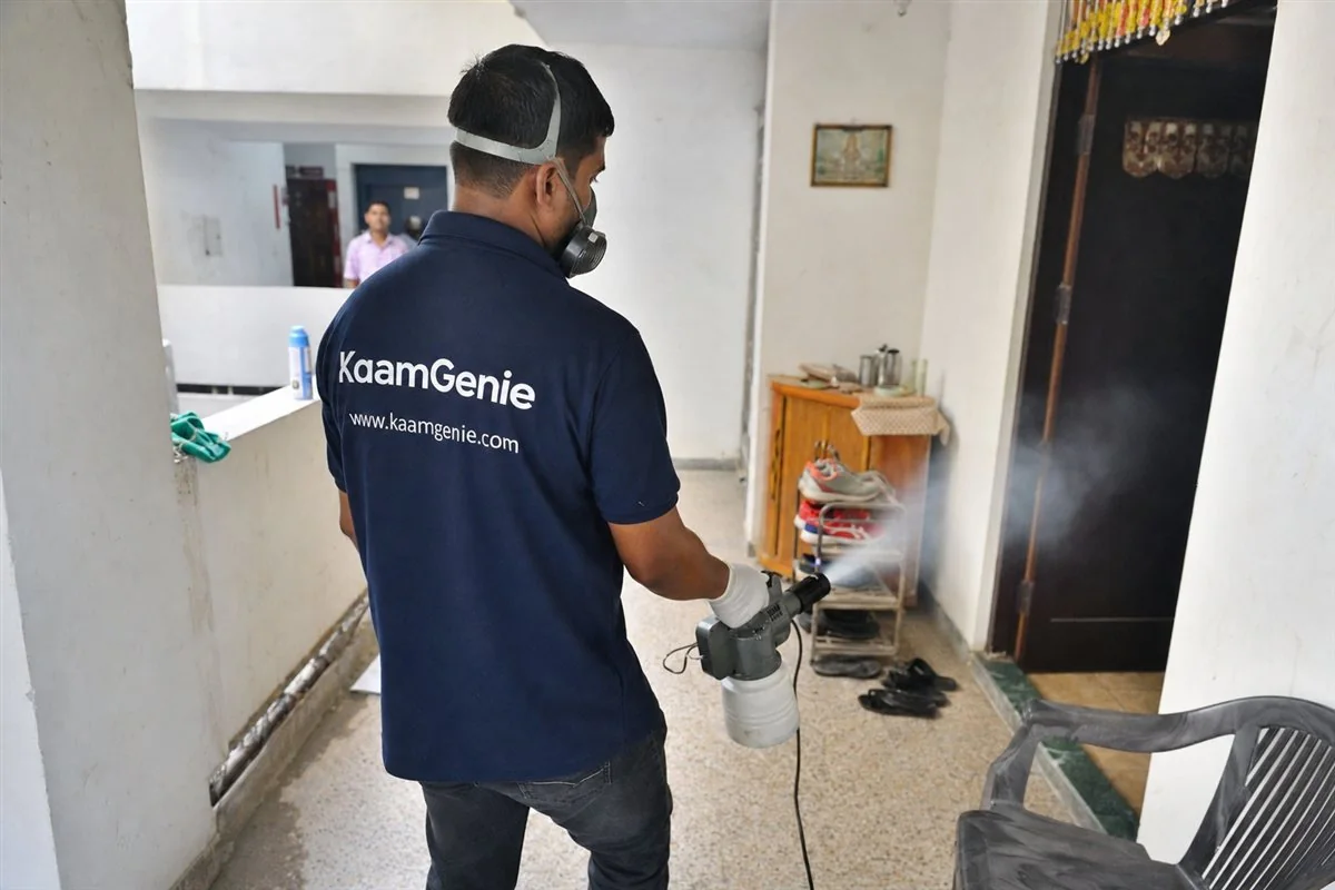 KaamGenie pest control technician treating a Rohini Sector 15 property in North-West Delhi