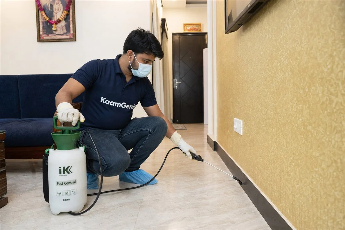 KaamGenie pest control technician treating a Rohini Sector 20 property in North-West Delhi