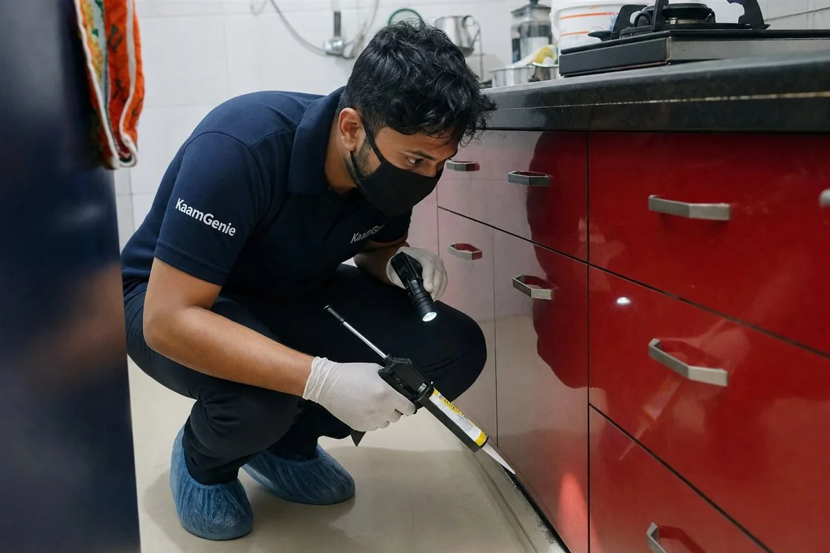 KaamGenie pest control technician treating a Rohini Sector 21 property in North-West Delhi