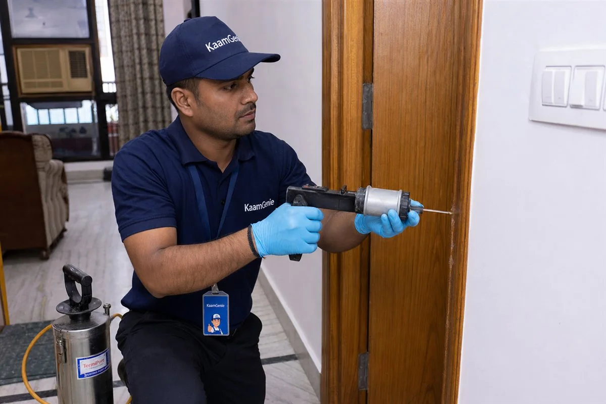 KaamGenie pest control technician treating a Rohini Sector 23 property in North-West Delhi