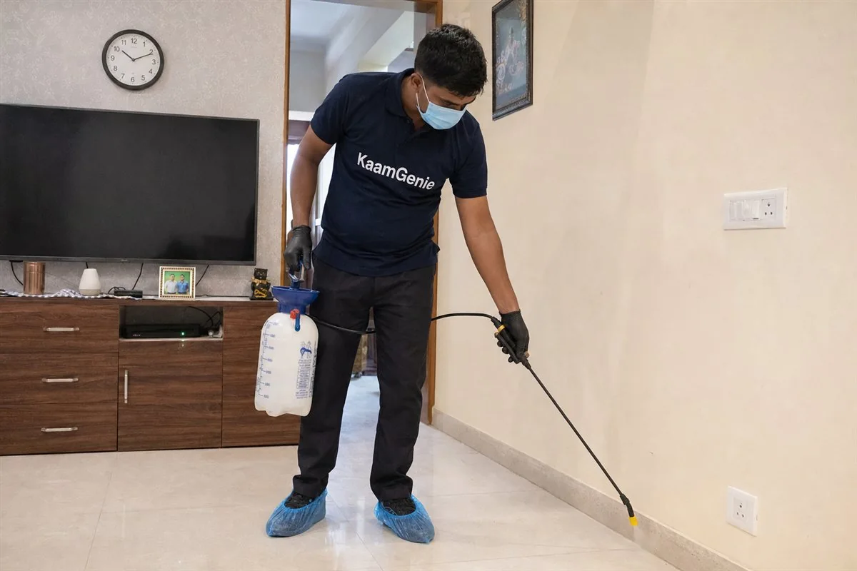 KaamGenie pest control technician treating a Rohini Sector 26 property in North-West Delhi