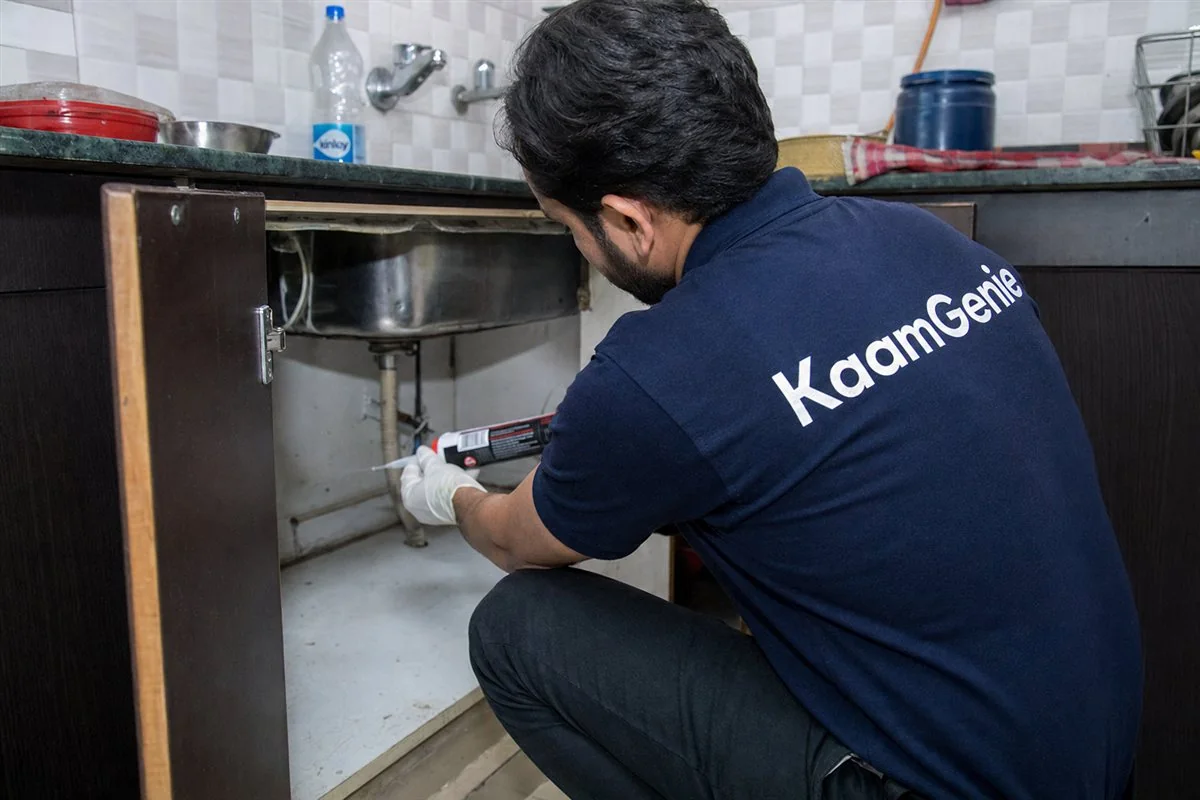 KaamGenie pest control technician treating a Rohini Sector 28 property in North-West Delhi
