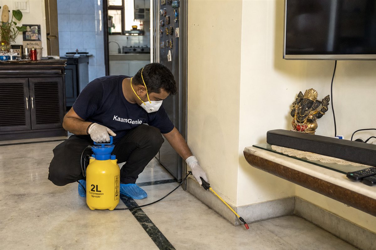 KaamGenie pest control technician treating a Rohini Sector 5 property in North-West Delhi