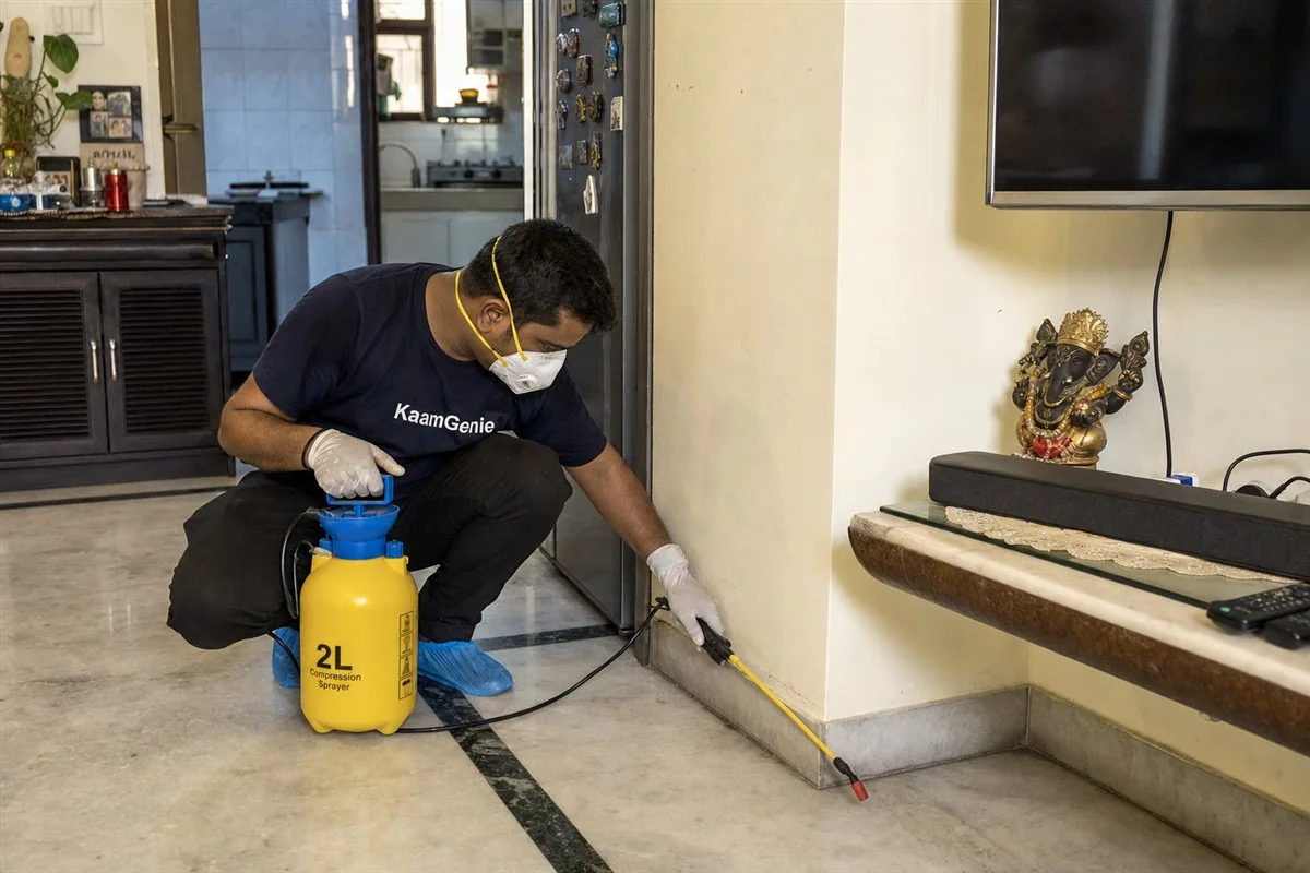 KaamGenie pest control technician treating a Rohini Sector 5 property in North-West Delhi