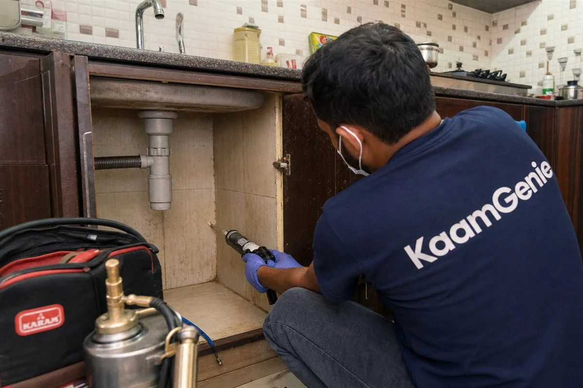 KaamGenie pest control technician treating a Rohini Sector 8 property in North-West Delhi