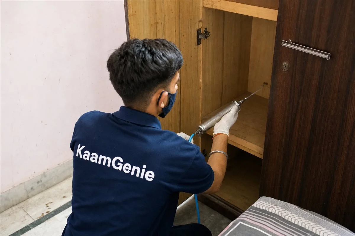 KaamGenie pest control technician treating an older DDA flat in Sadiq Nagar, South Delhi