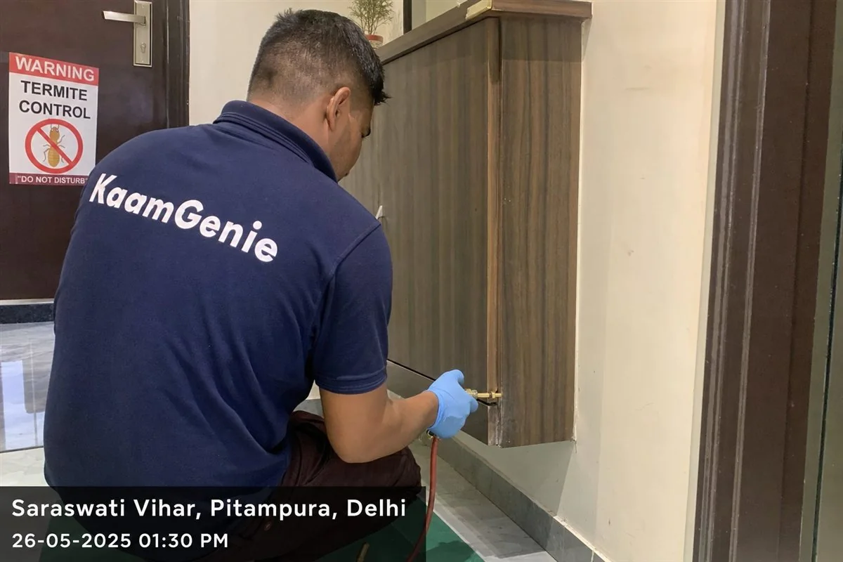 KaamGenie pest control technician treating a Saraswati Vihar property in North-West Delhi