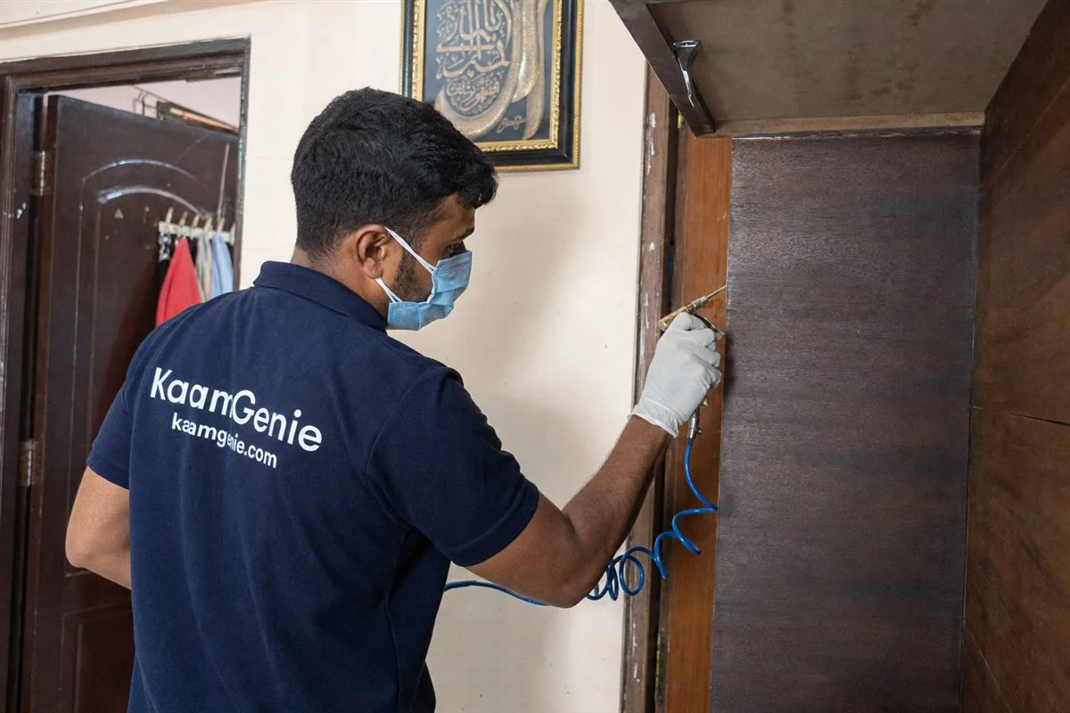 KaamGenie pest control technician treating a Satyawati Nagar property in North-West Delhi