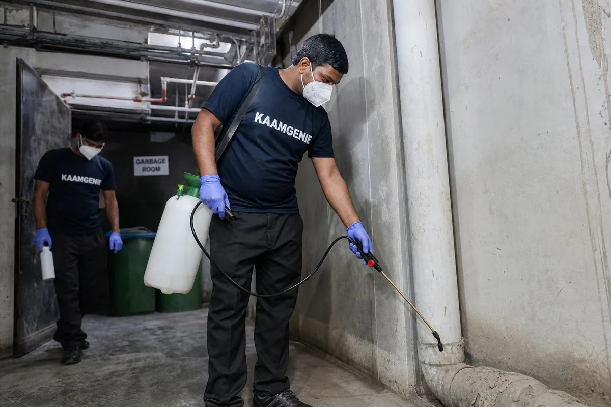 KaamGenie pest control technician treating a Sector 150 property in Noida