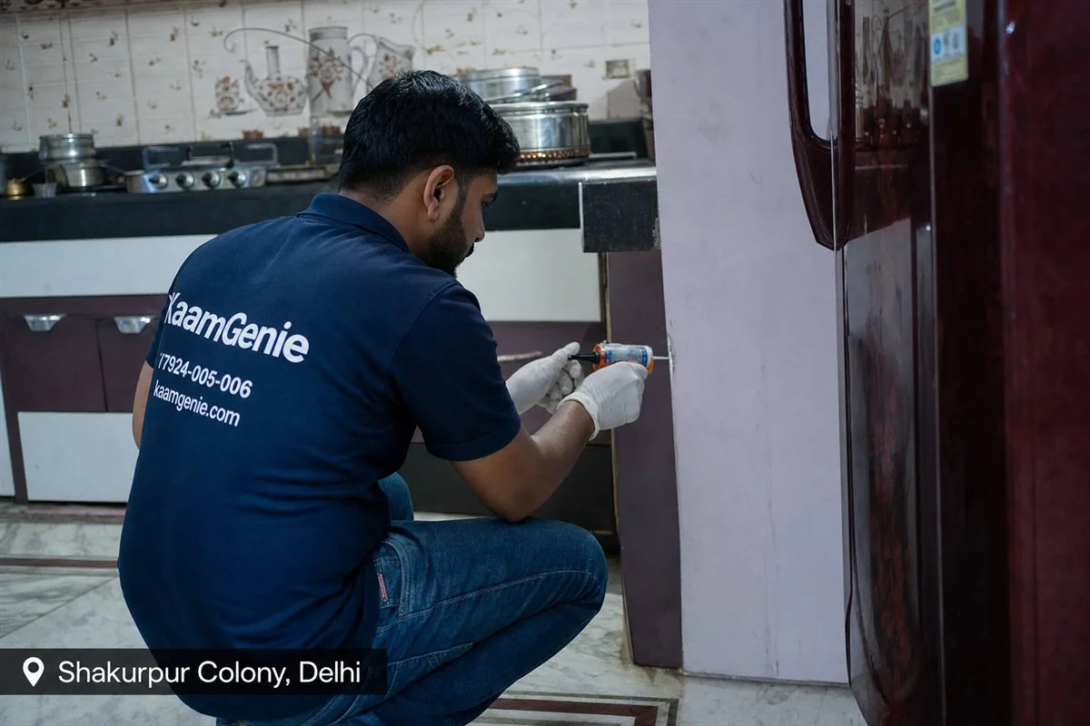 KaamGenie pest control technician treating a Shakurpur property in North-West Delhi