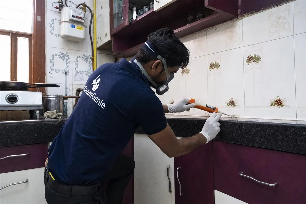 KaamGenie pest control technician treating a Sheikh Sarai property in South Delhi