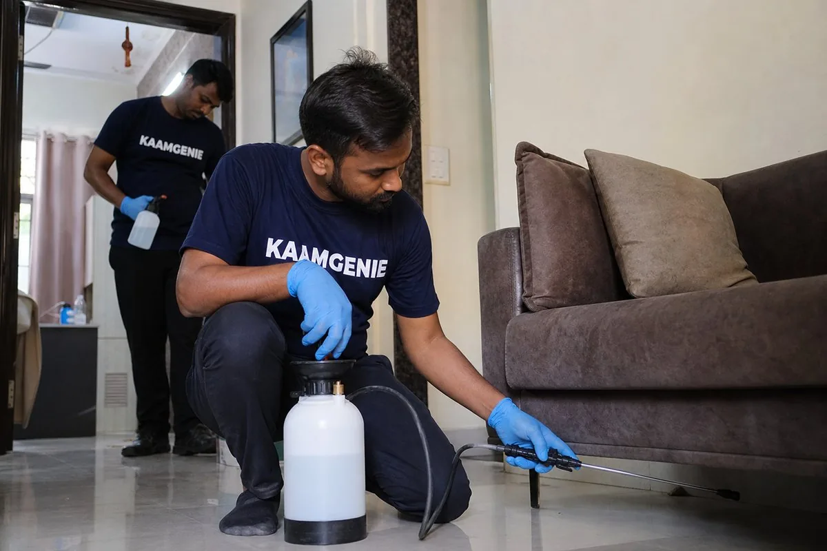 KaamGenie pest control technician treating a Siddharth Extension property in South Delhi