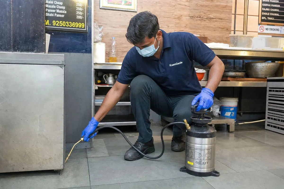 KaamGenie pest control technician treating a Tilak Nagar property in West Delhi