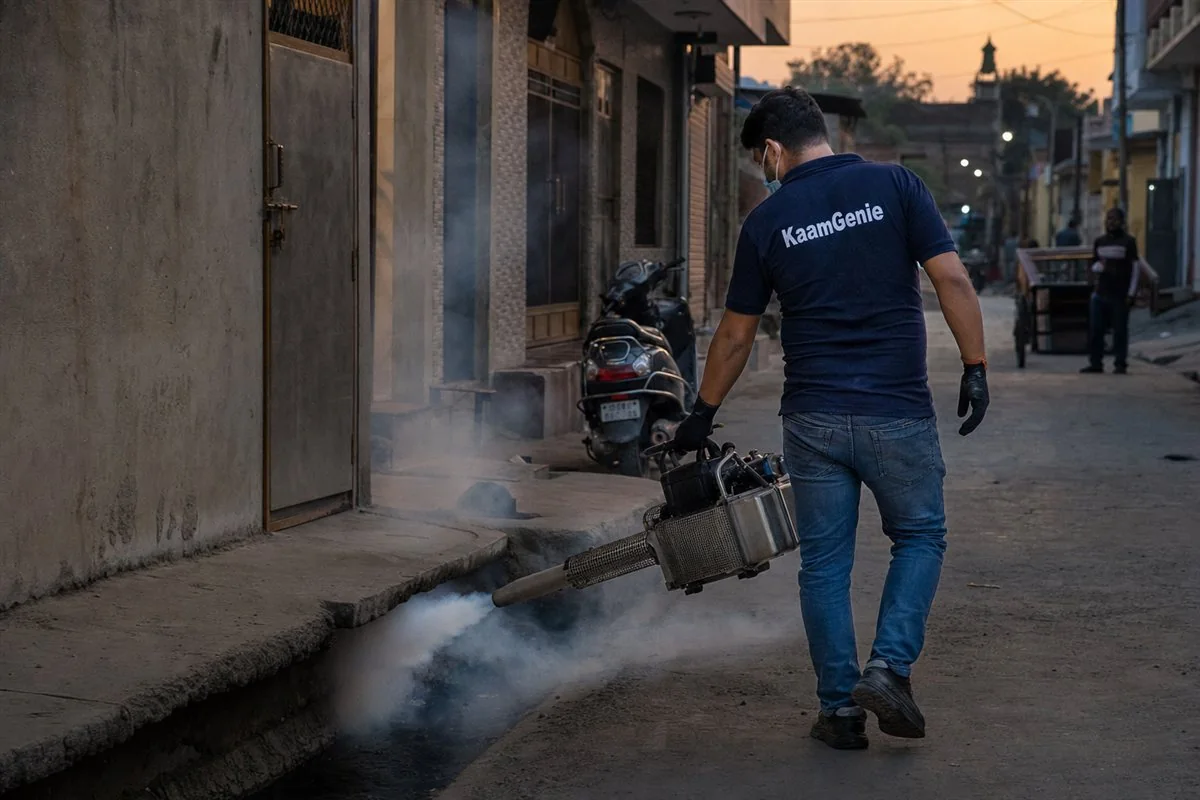 KaamGenie pest control technician treating a Trilok Puri property in East Delhi