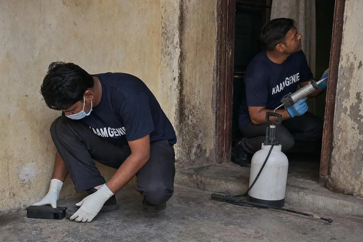 KaamGenie pest control technician treating a Tughlakabad property in South Delhi