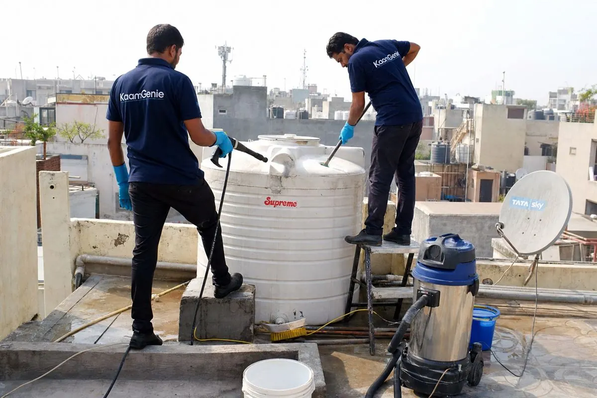 KaamGenie crew cleaning a water tank in Sainik Farms, Delhi