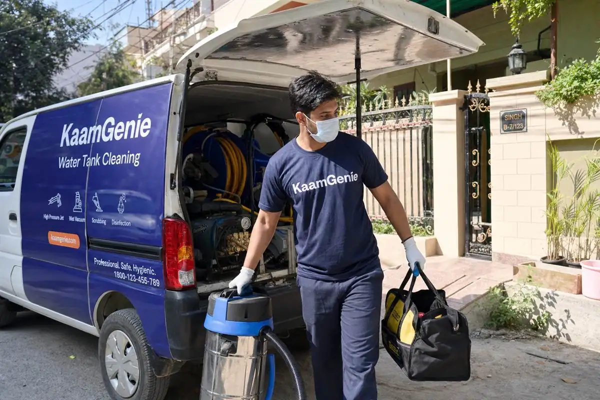 KaamGenie same-day water tank cleaning crew arriving at a Delhi home, same-day near-you service