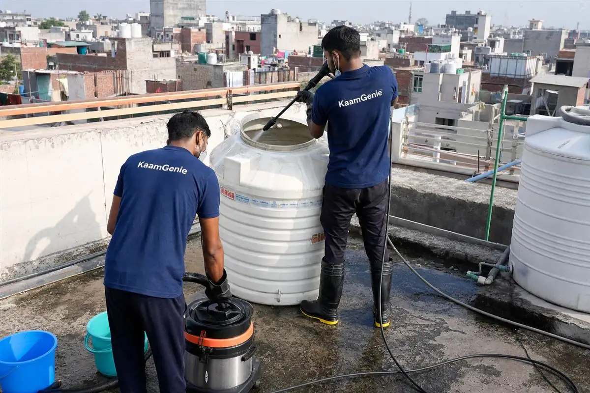 KaamGenie crew cleaning a water tank in Sangam Vihar Extension, Delhi