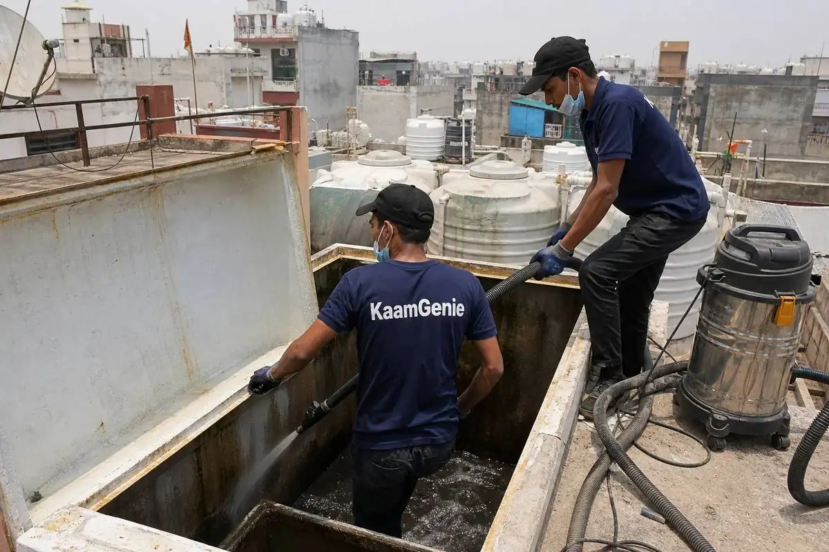KaamGenie crew cleaning a water tank in Sant Nagar, North Delhi