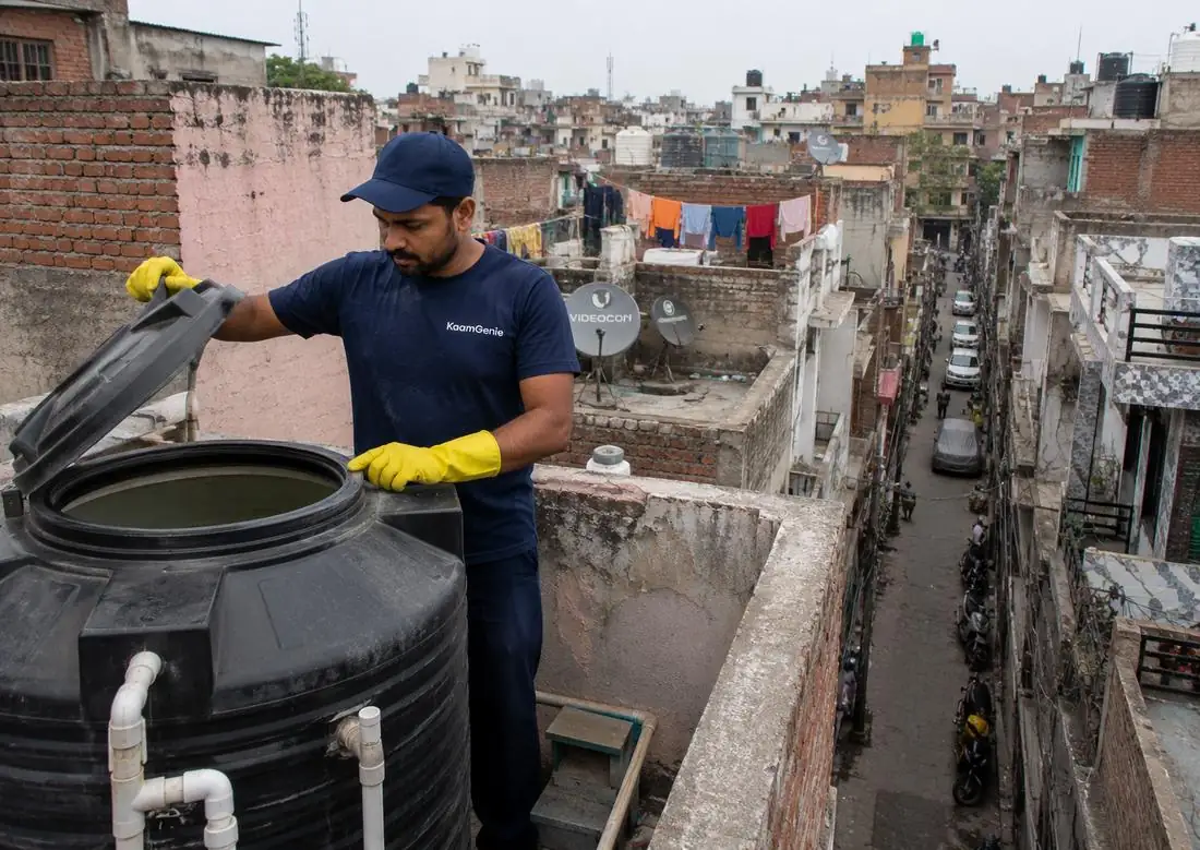 KaamGenie crew cleaning a water tank in Shastri Nagar, East Delhi
