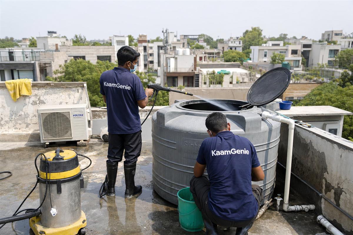 KaamGenie crew cleaning a water tank in Sheikh Sarai, Delhi