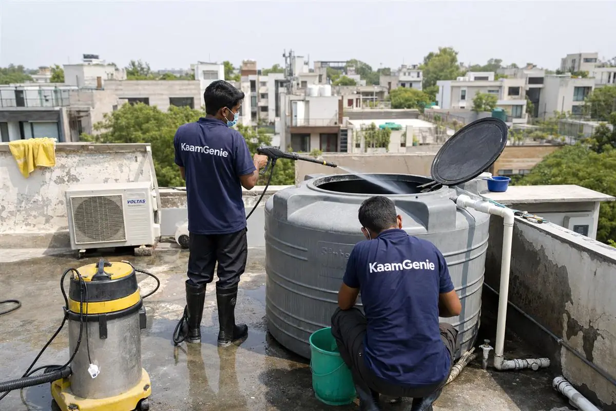 KaamGenie crew cleaning a water tank in Sheikh Sarai, Delhi