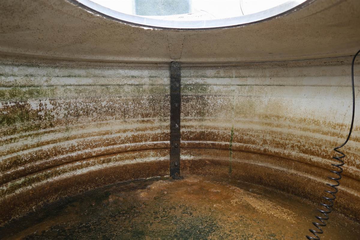 Heavy white calcium scale crusted on a tap and inside a kettle in a Noida home, caused by hard borewell groundwater