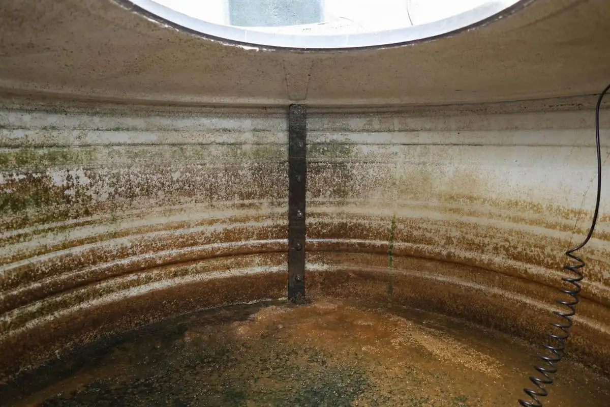 Heavy white calcium scale crusted on a tap and inside a kettle in a Noida home, caused by hard borewell groundwater