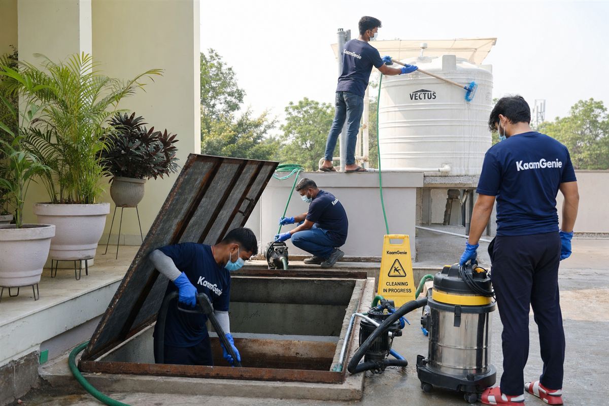 KaamGenie crew cleaning both an underground sump and a rooftop overhead water tank in one visit at a Delhi kothi