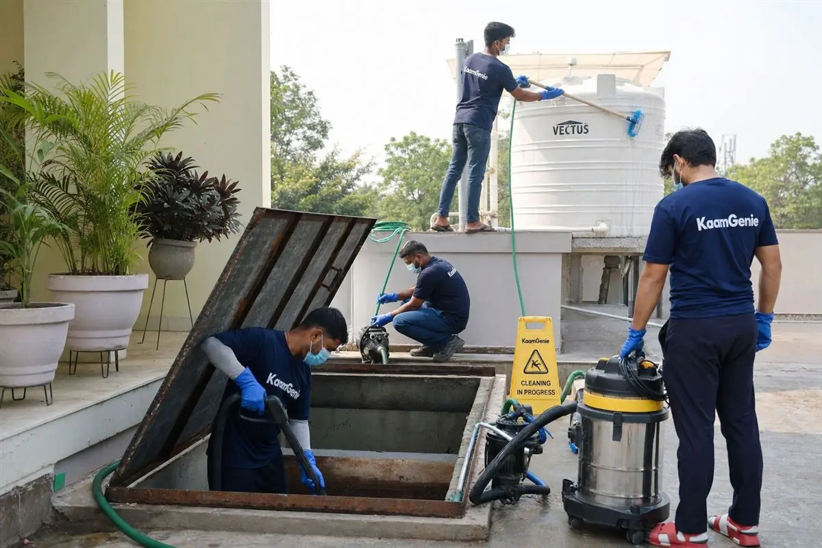 KaamGenie crew cleaning both an underground sump and a rooftop overhead water tank in one visit at a Delhi kothi