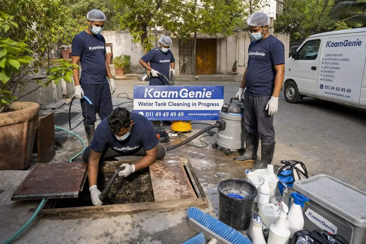 KaamGenie crew cleaning both an underground sump and a rooftop overhead water tank in one visit at a Delhi kothi