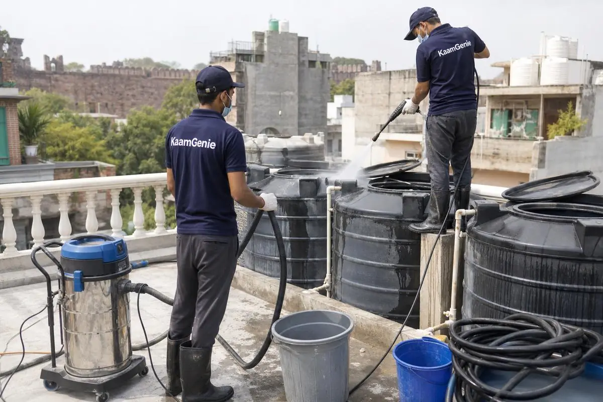 KaamGenie crew cleaning a water tank in Sundar Nagar, Delhi