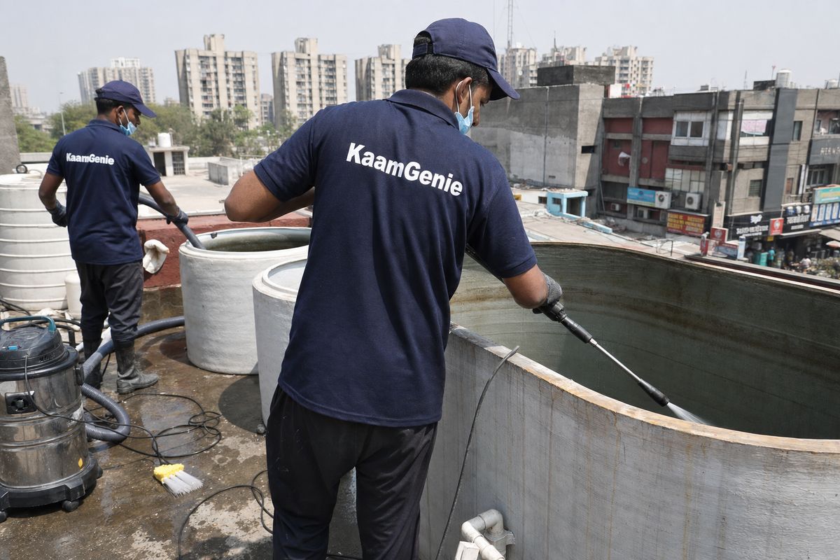 KaamGenie crew cleaning a commercial water tank in Dwarka Sector 12, Delhi