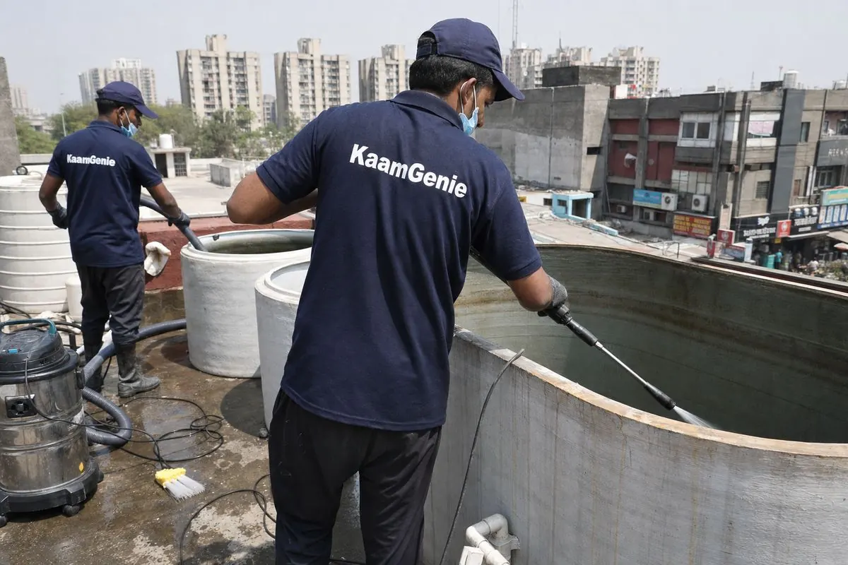 KaamGenie crew cleaning a commercial water tank in Dwarka Sector 12, Delhi