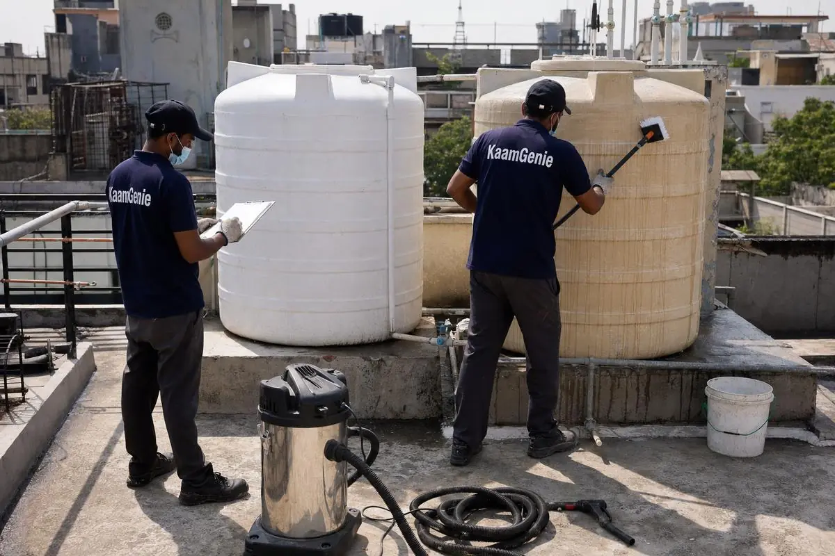 KaamGenie crew cleaning a commercial water tank in Greater Kailash, Delhi