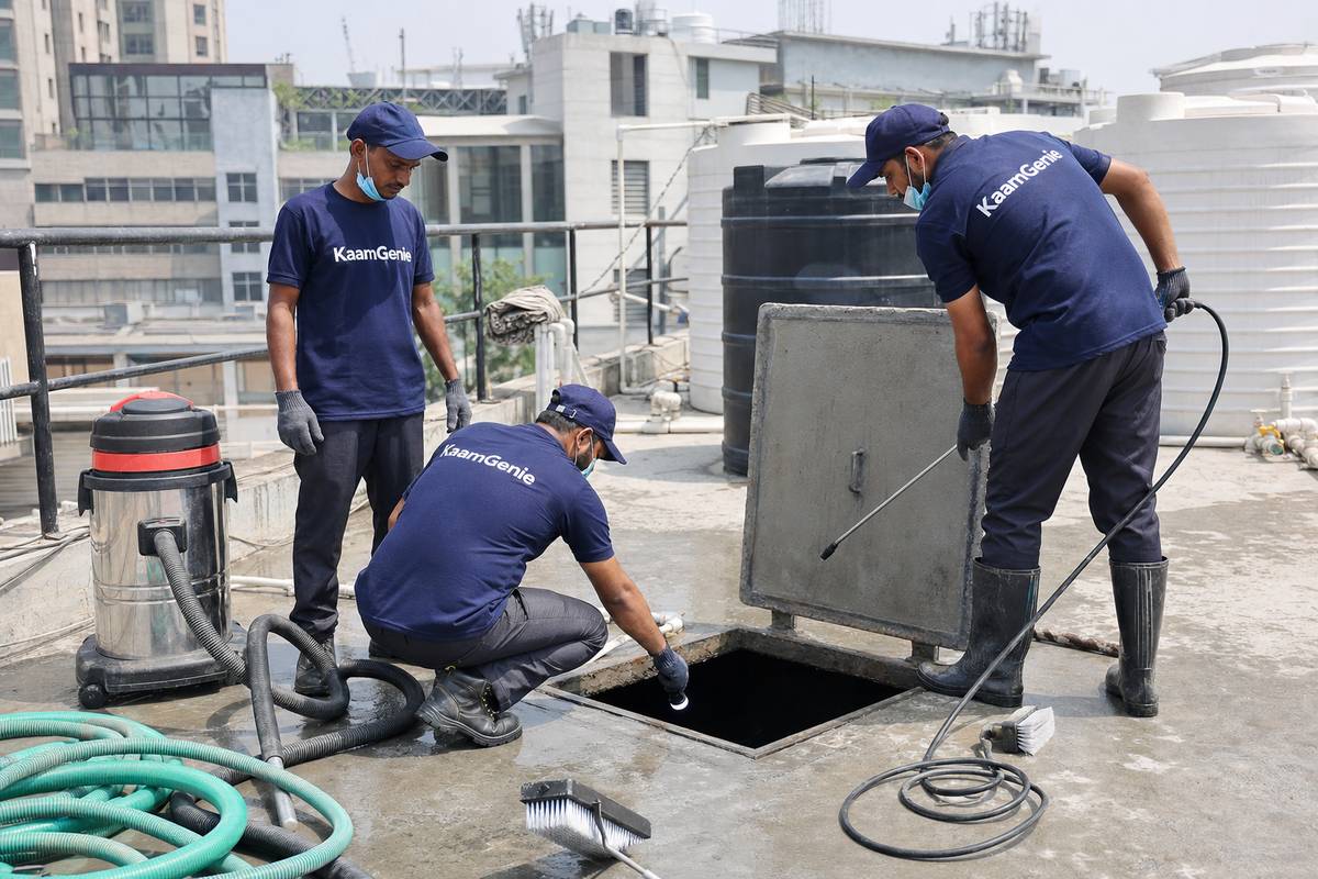 KaamGenie crew cleaning a commercial water tank in Saket, Delhi
