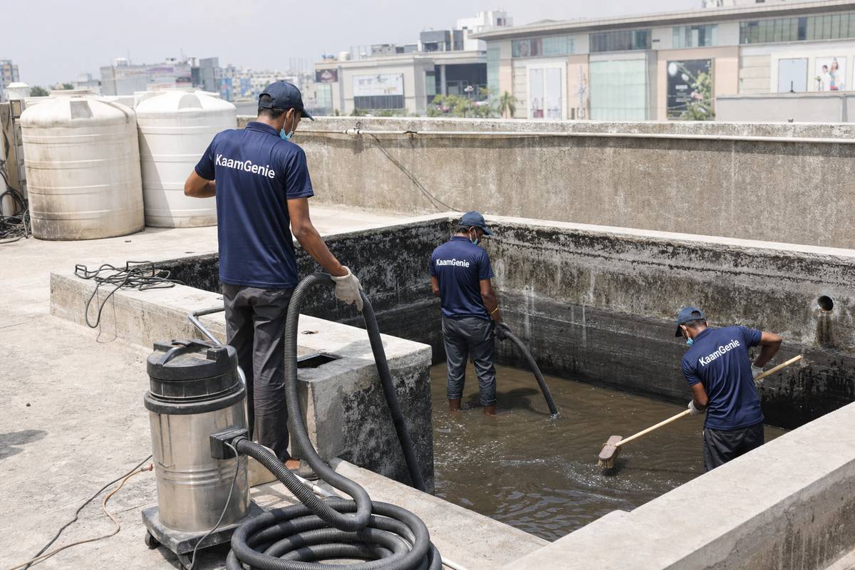 KaamGenie crew cleaning a commercial water tank in Vasant Kunj, Delhi