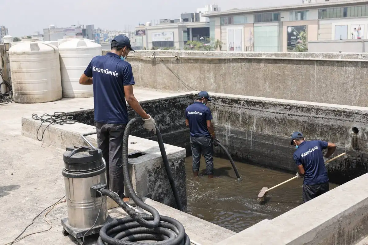 KaamGenie crew cleaning a commercial water tank in Vasant Kunj, Delhi